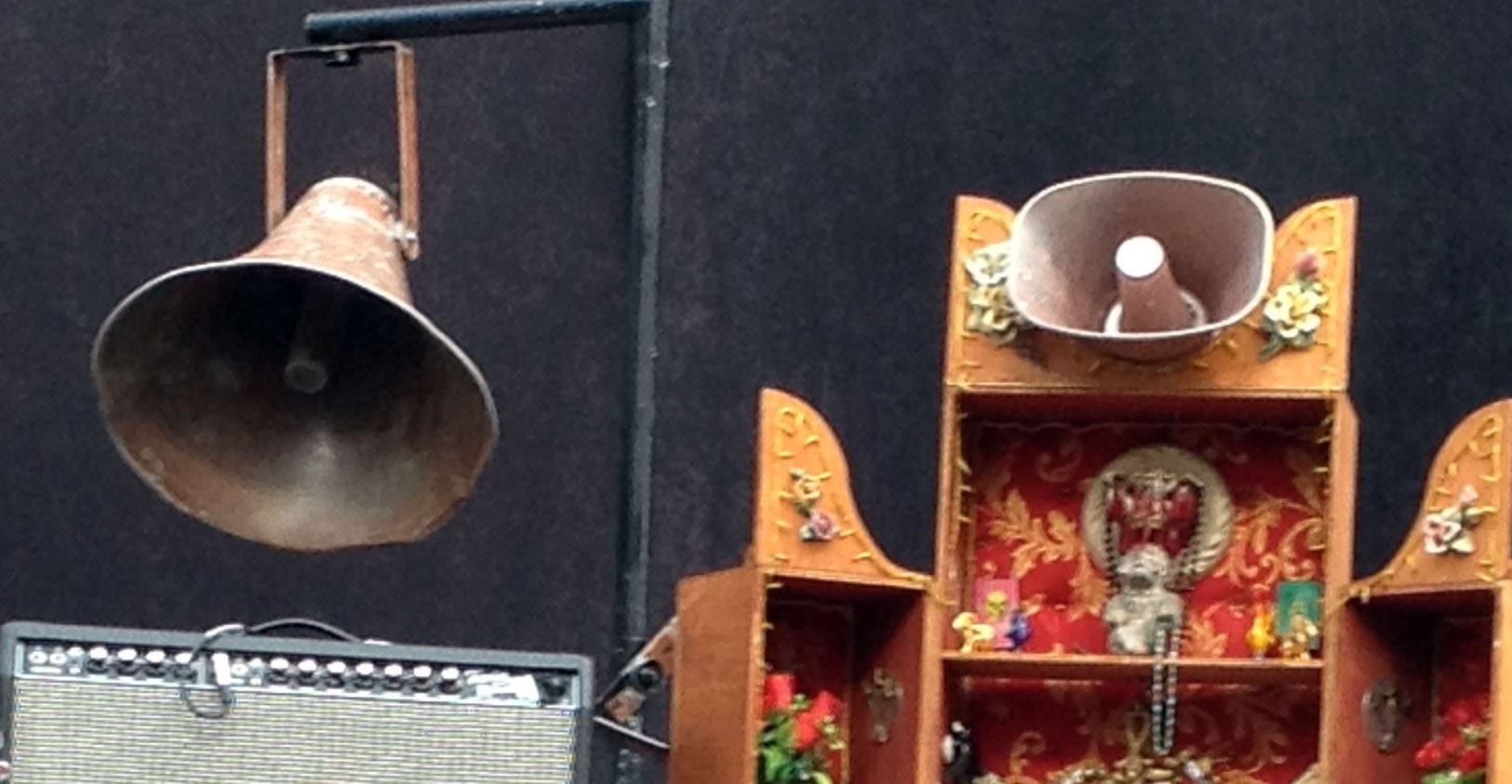 A decorative image showing two speaker cones