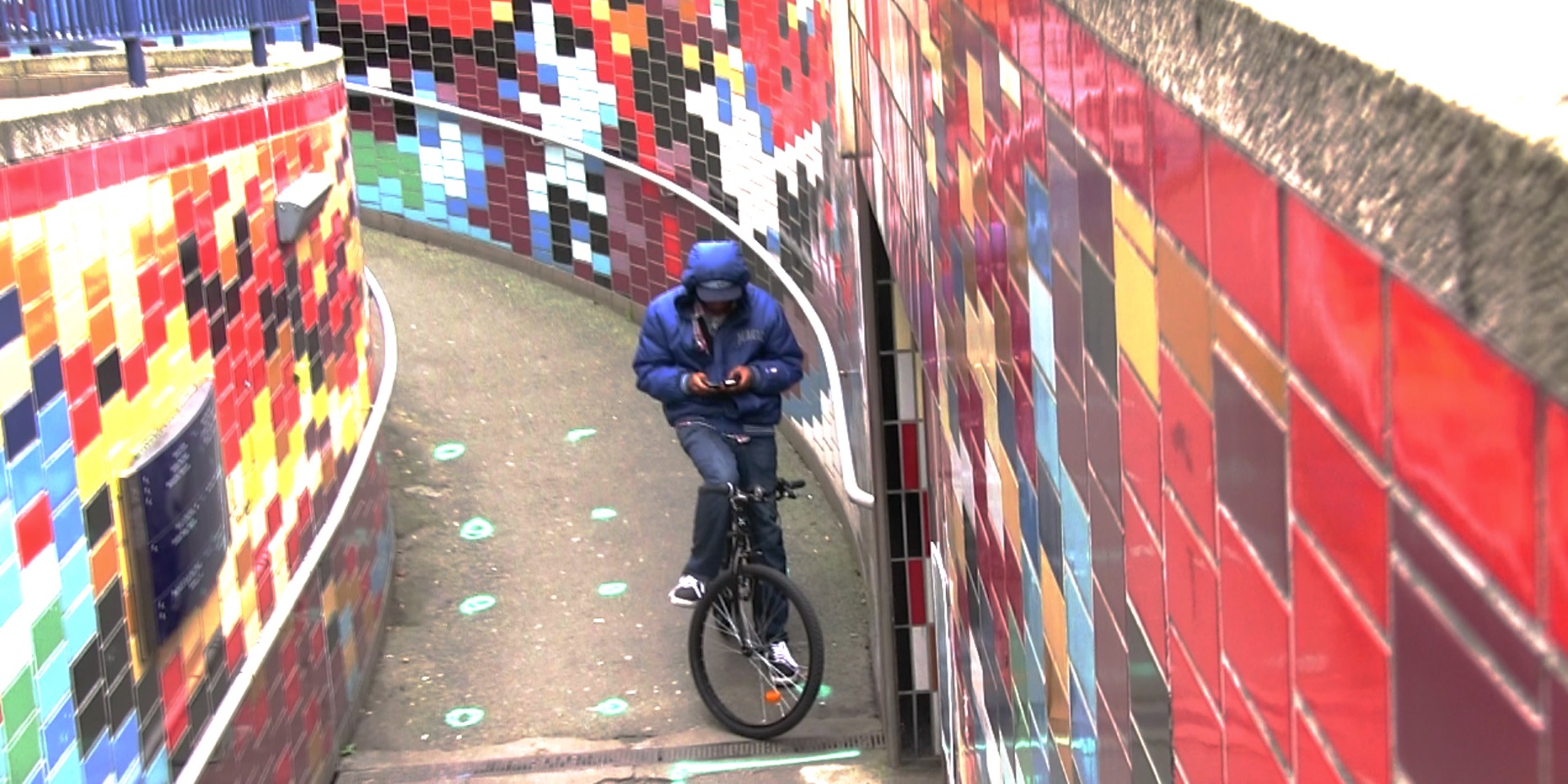 Image of a boy on a bike in the elephant and castle subway