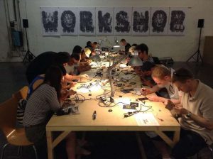 An electronics workshop group soldering