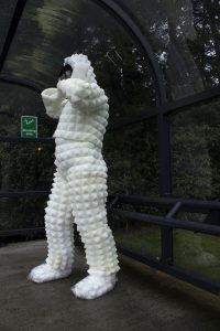 The artist in a white foam suit