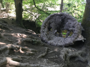 An installation image of a sculpture in the woods