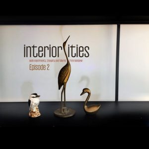 Three ornaments of animals infront of a white background and text that reads "interiorities episode 2"