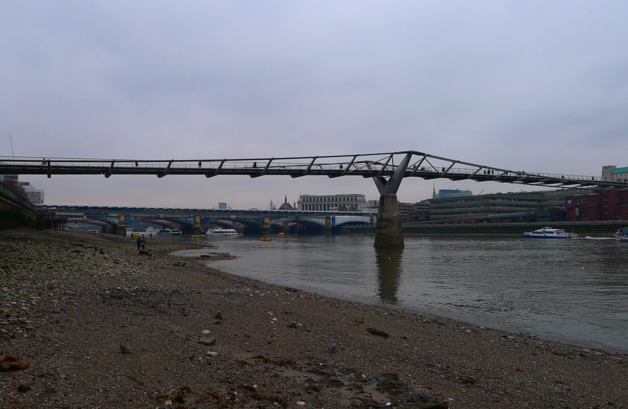 The river thames with bridge stretching over
