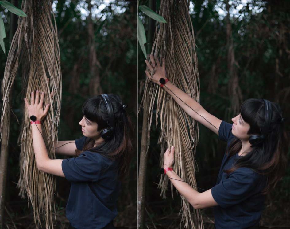 Profile image of Mélia Roger touching a tree with sensors on hands